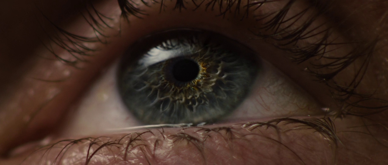 a close up of a person's blue eye