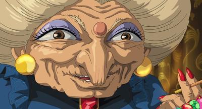 an old woman with big blue eyes holding a cigarette