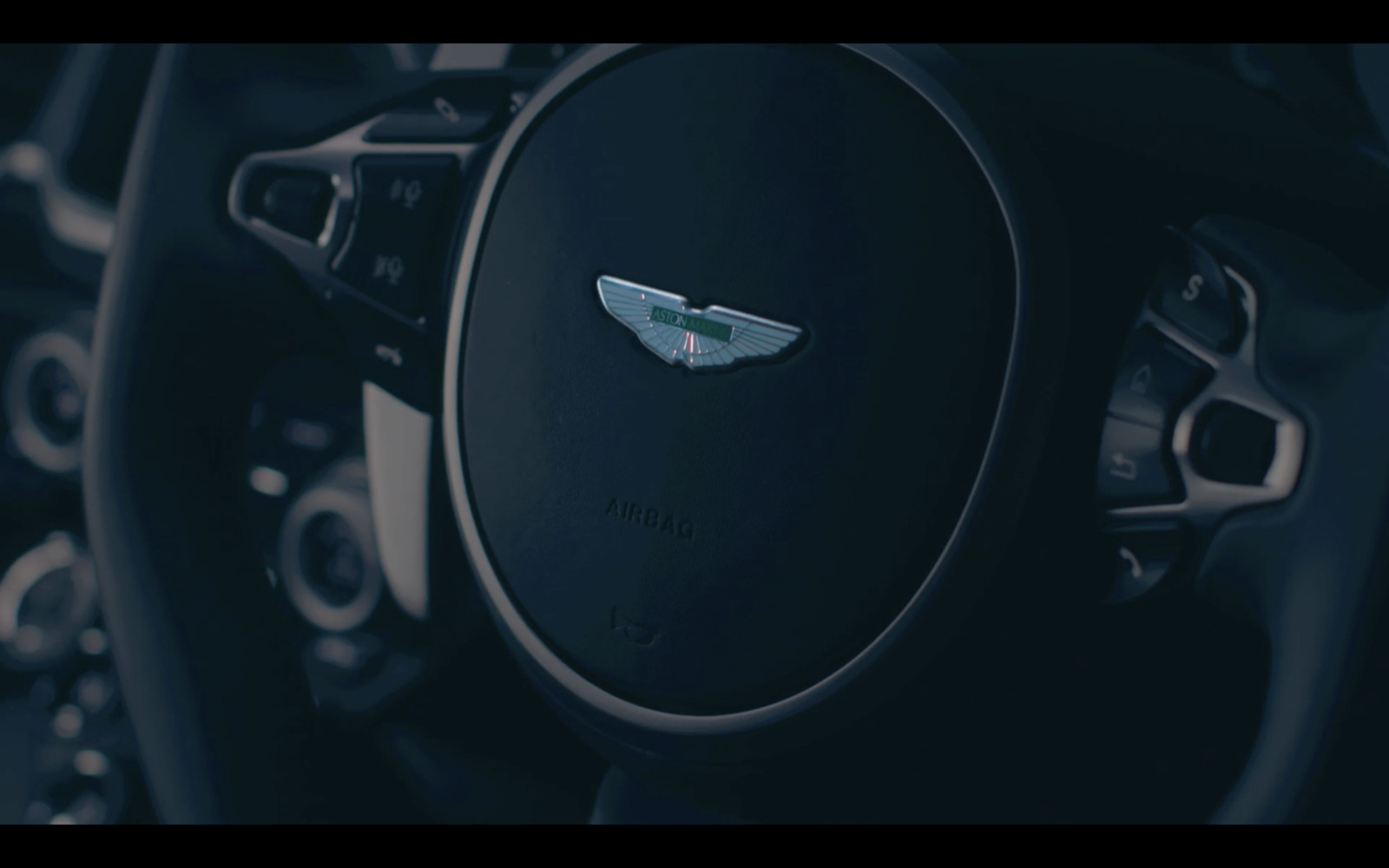 a close up of the steering wheel of a car