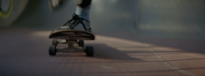 a person riding a skateboard down a ramp