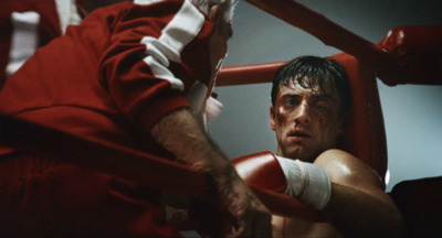 a man with bandages on his arm in a boxing ring