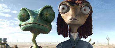 a woman and a frog are standing in the desert