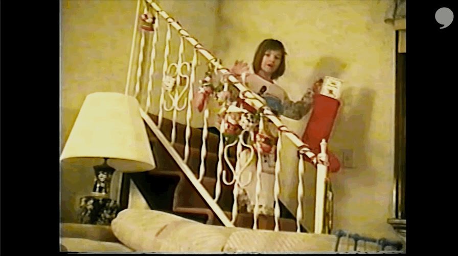 a woman standing on a stair case next to a lamp