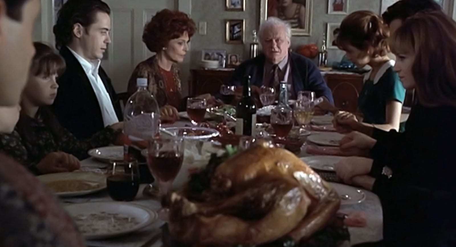 a group of people sitting around a dinner table