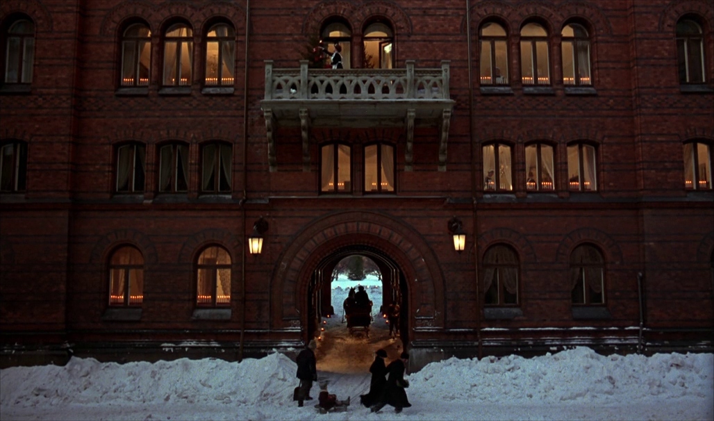 a group of people standing in front of a building