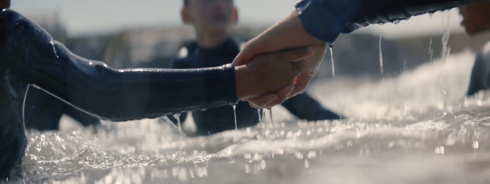 a close up of two people shaking hands