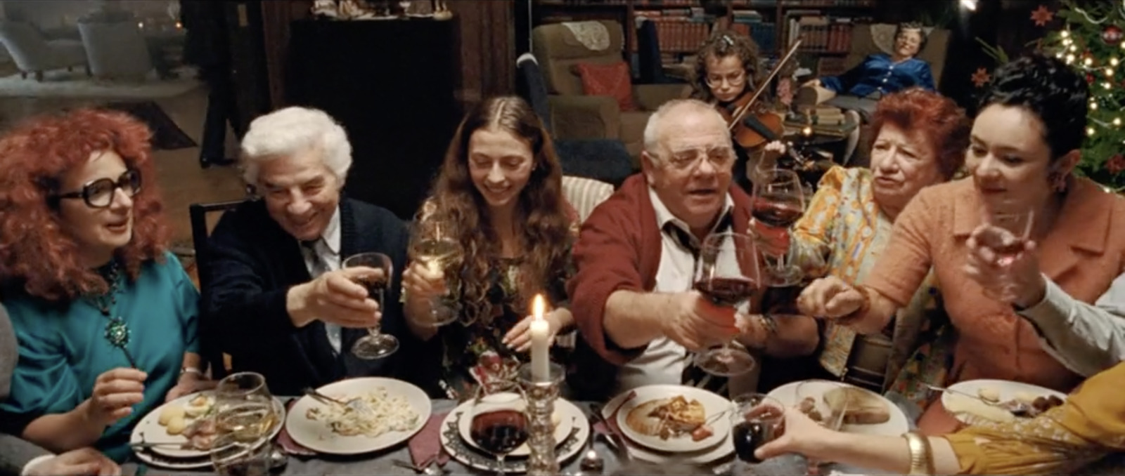 a group of people sitting around a dinner table