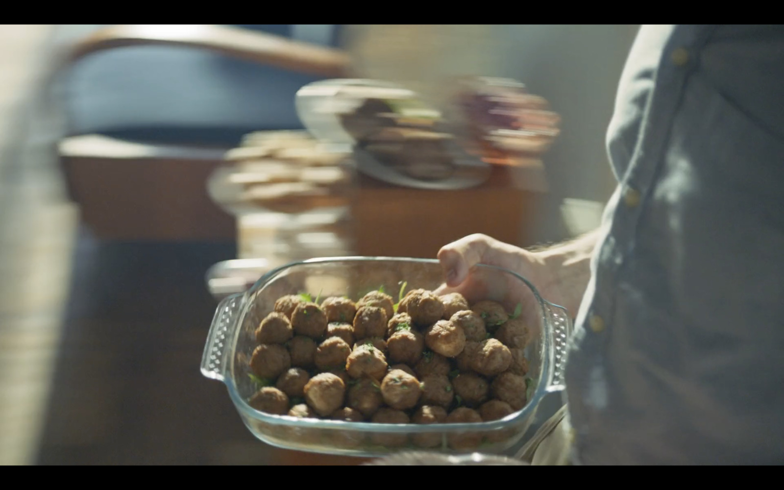 a person is holding a bowl of food