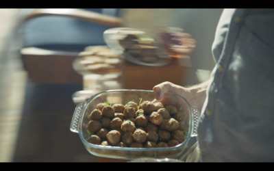 a person is holding a bowl of food