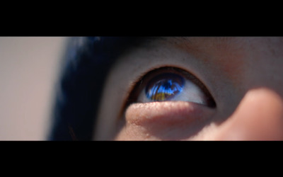 a close up of a person's blue eye