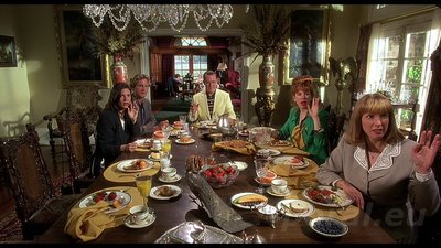 a group of people sitting around a dining table