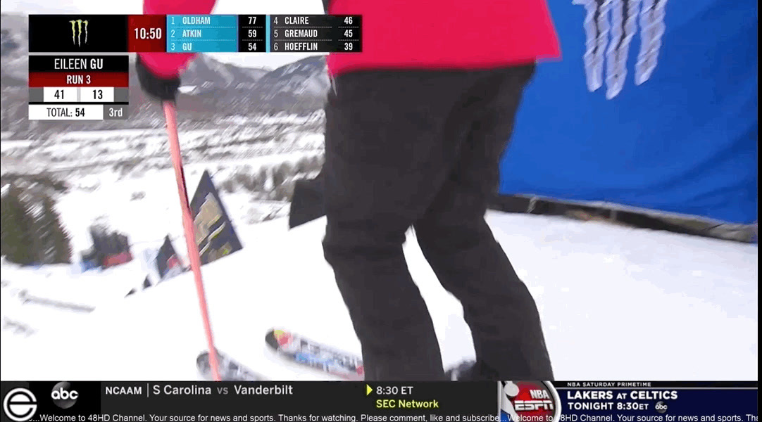 a person riding skis on top of a snow covered slope