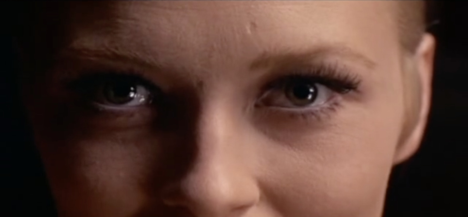 a close up of a woman's face and eyes