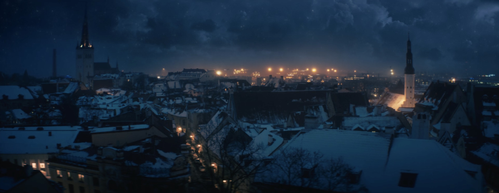 a view of a city at night from a rooftop