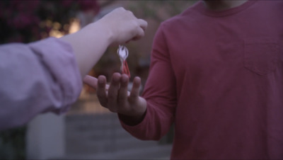 a person holding a toothbrush in their hand