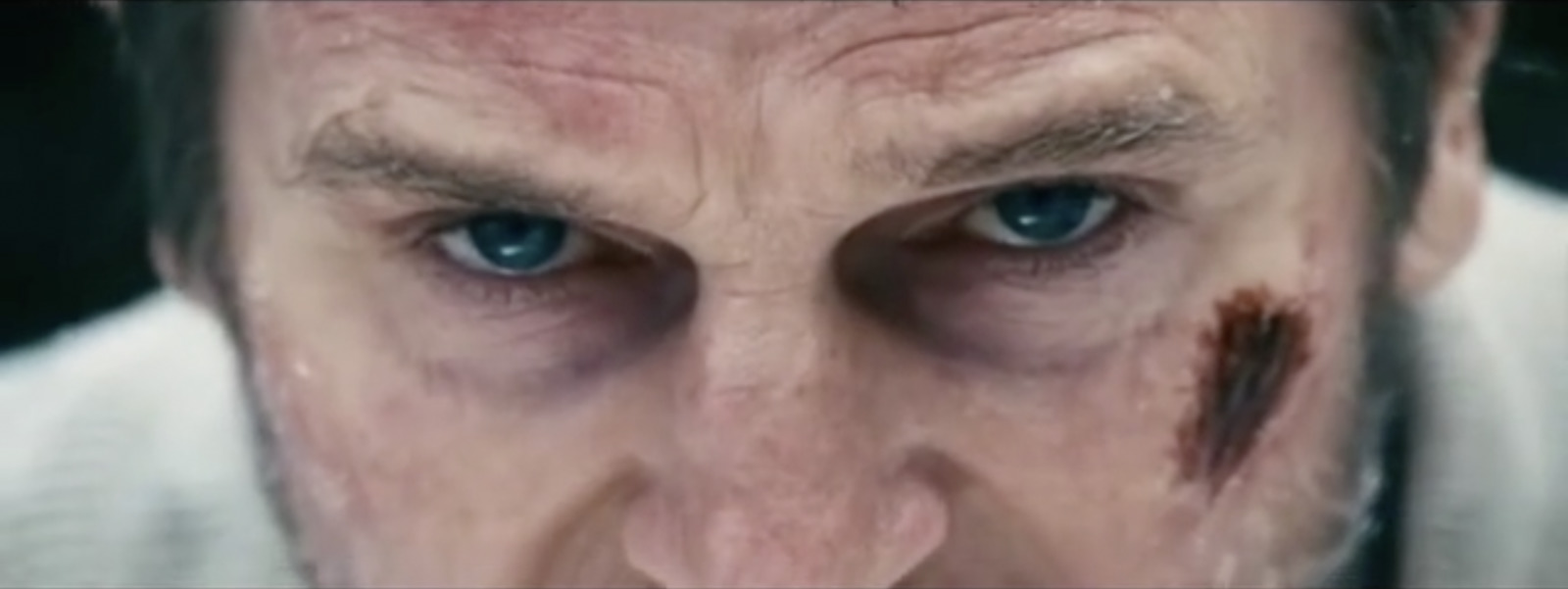 a close up of a person with blue eyes