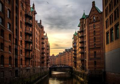 a river running through a city next to tall buildings