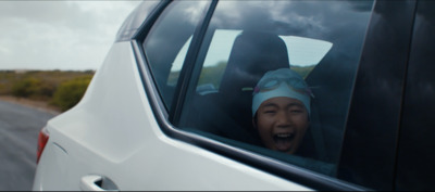 a woman sticking her head out of a car window