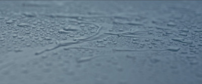 a close up of water droplets on a surface