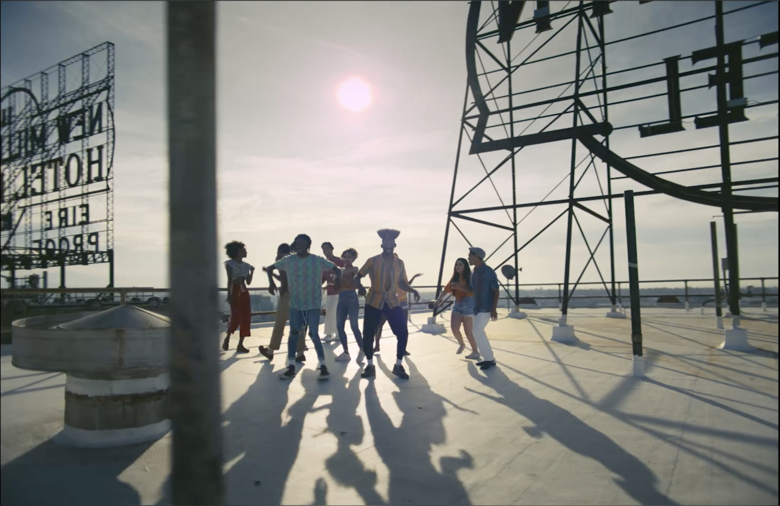 a group of people standing on top of a roof