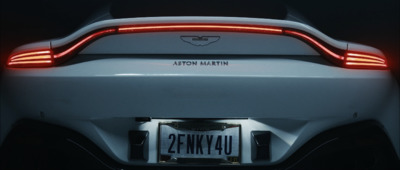 the tail light of a white sports car