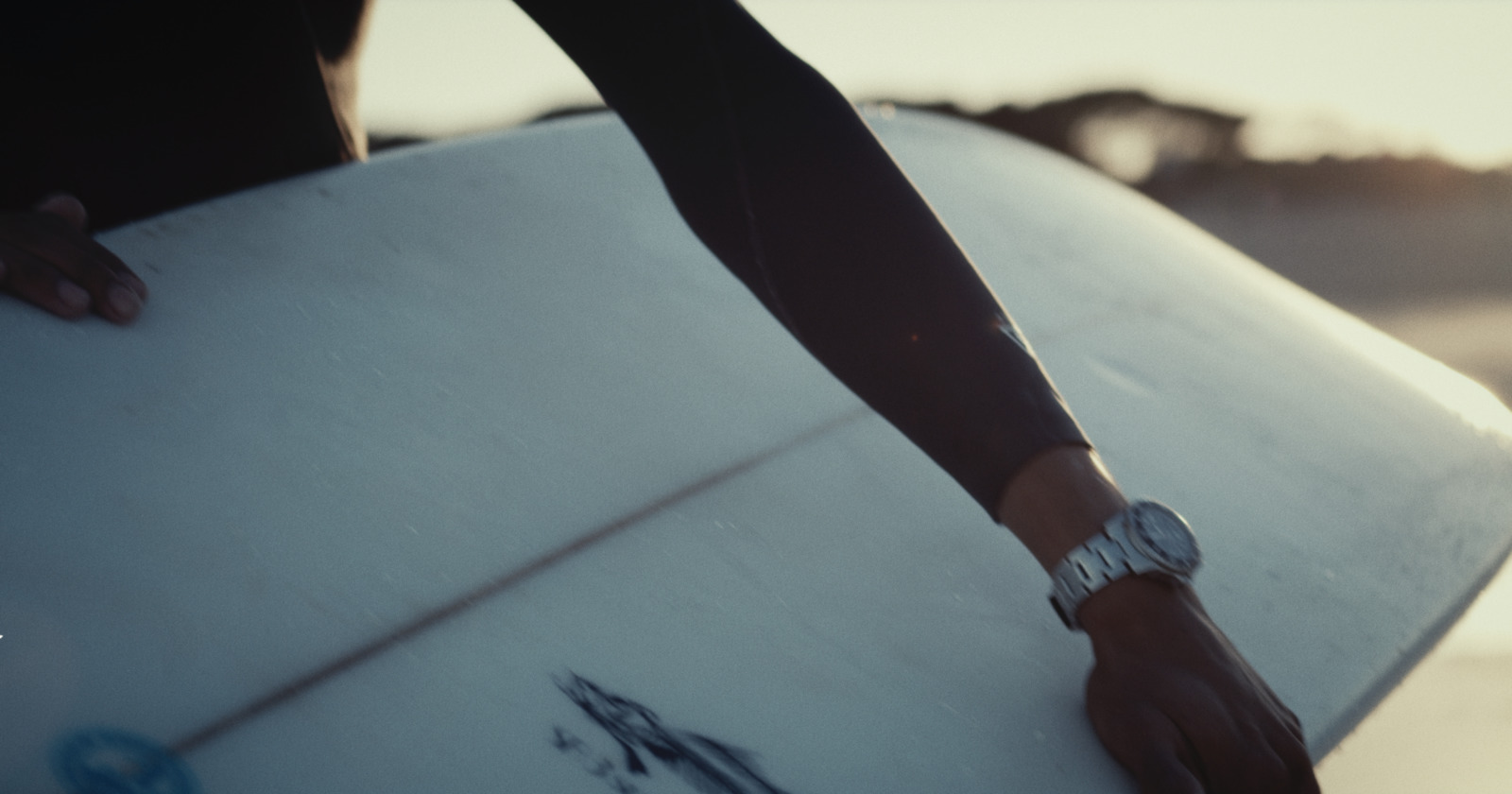 a close up of a person holding a surfboard