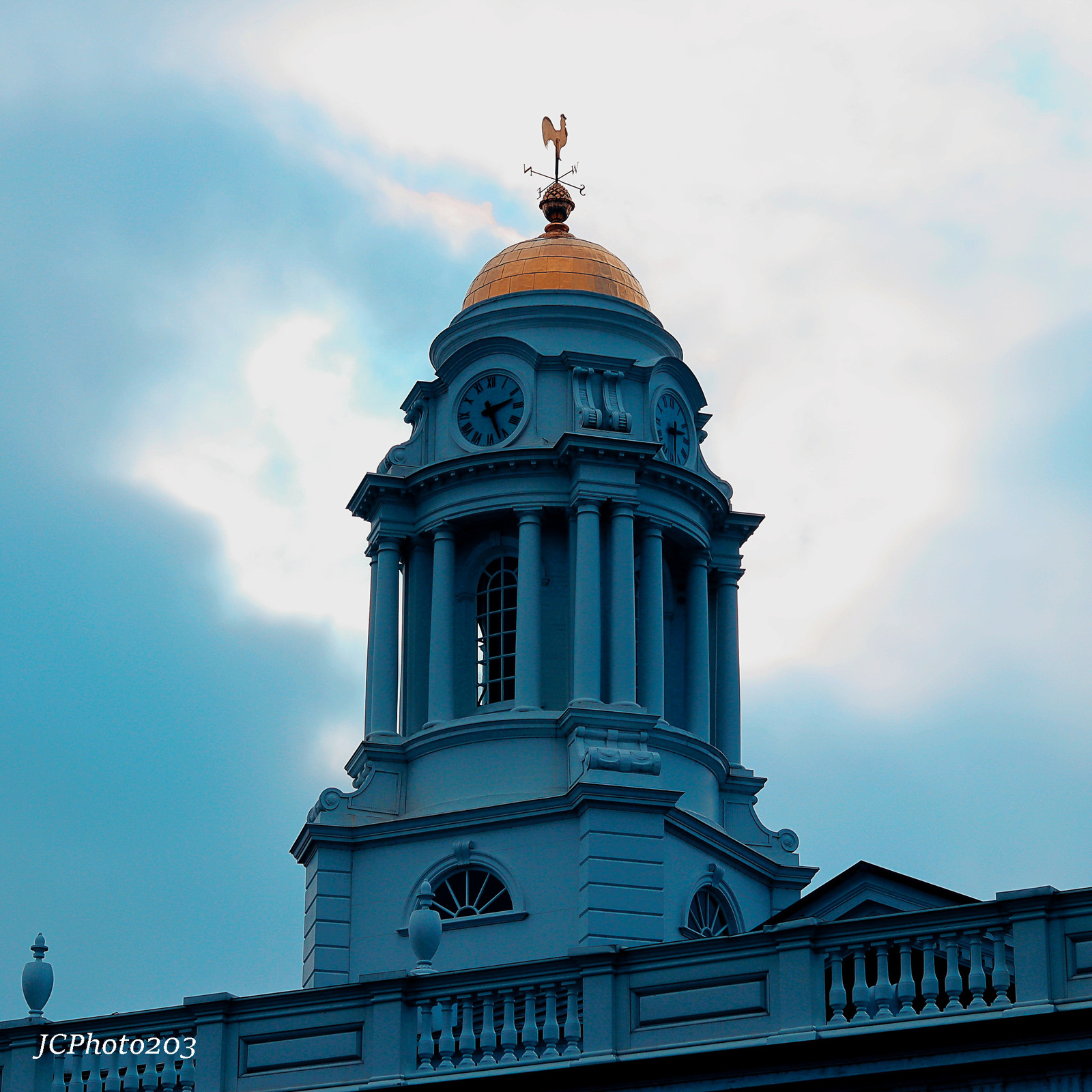 a blue building with a gold dome on top