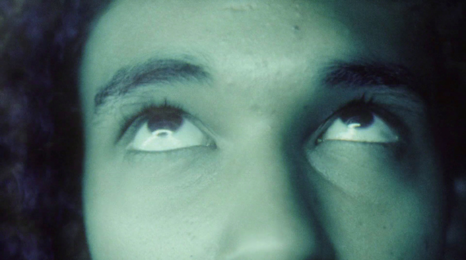 a close up of a person's face and eyes