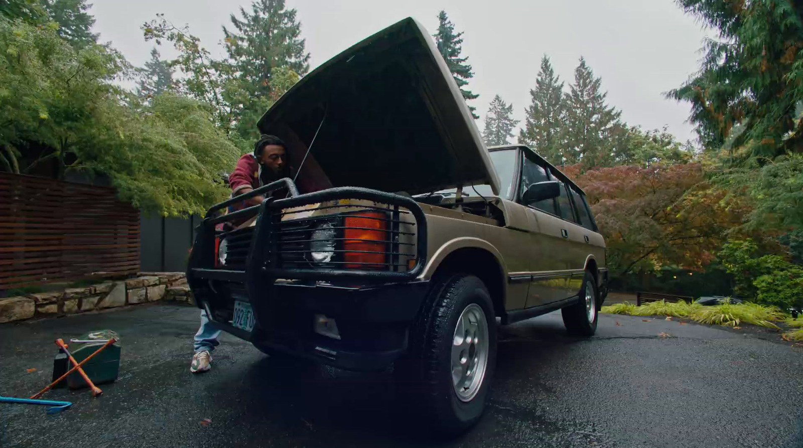 a couple of people sitting in the back of a truck