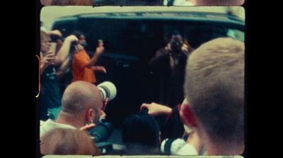 a group of people standing in front of a van