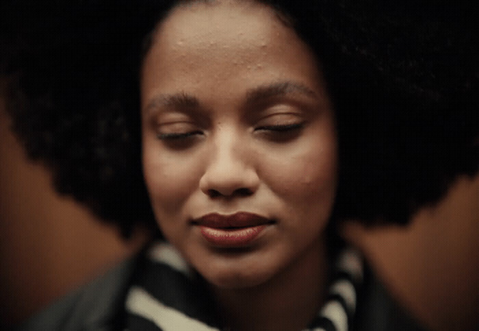 a close up of a woman with her eyes closed