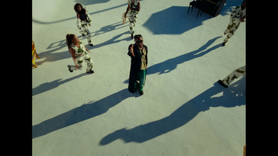 a group of people standing on top of a snow covered slope