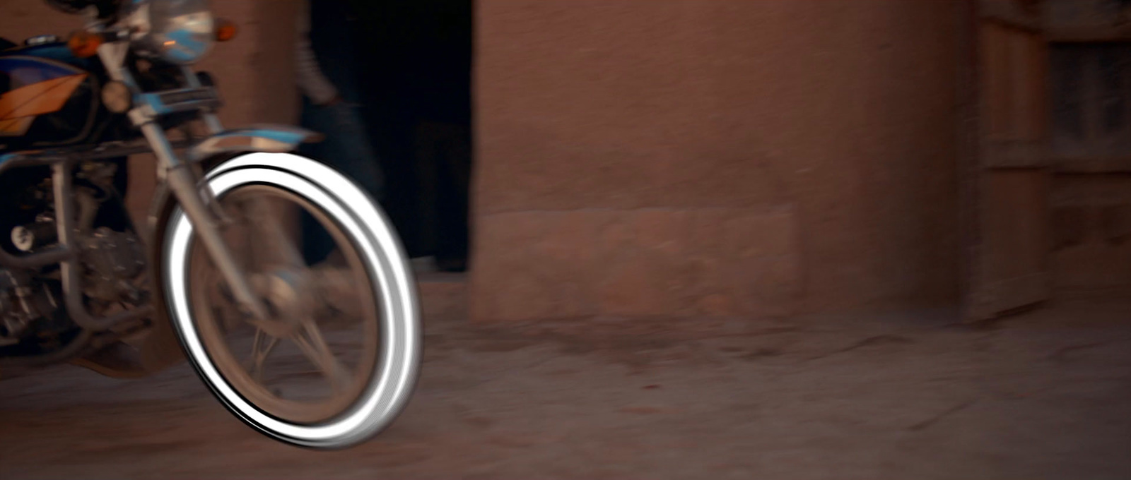 a blurry photo of a motorcycle wheel