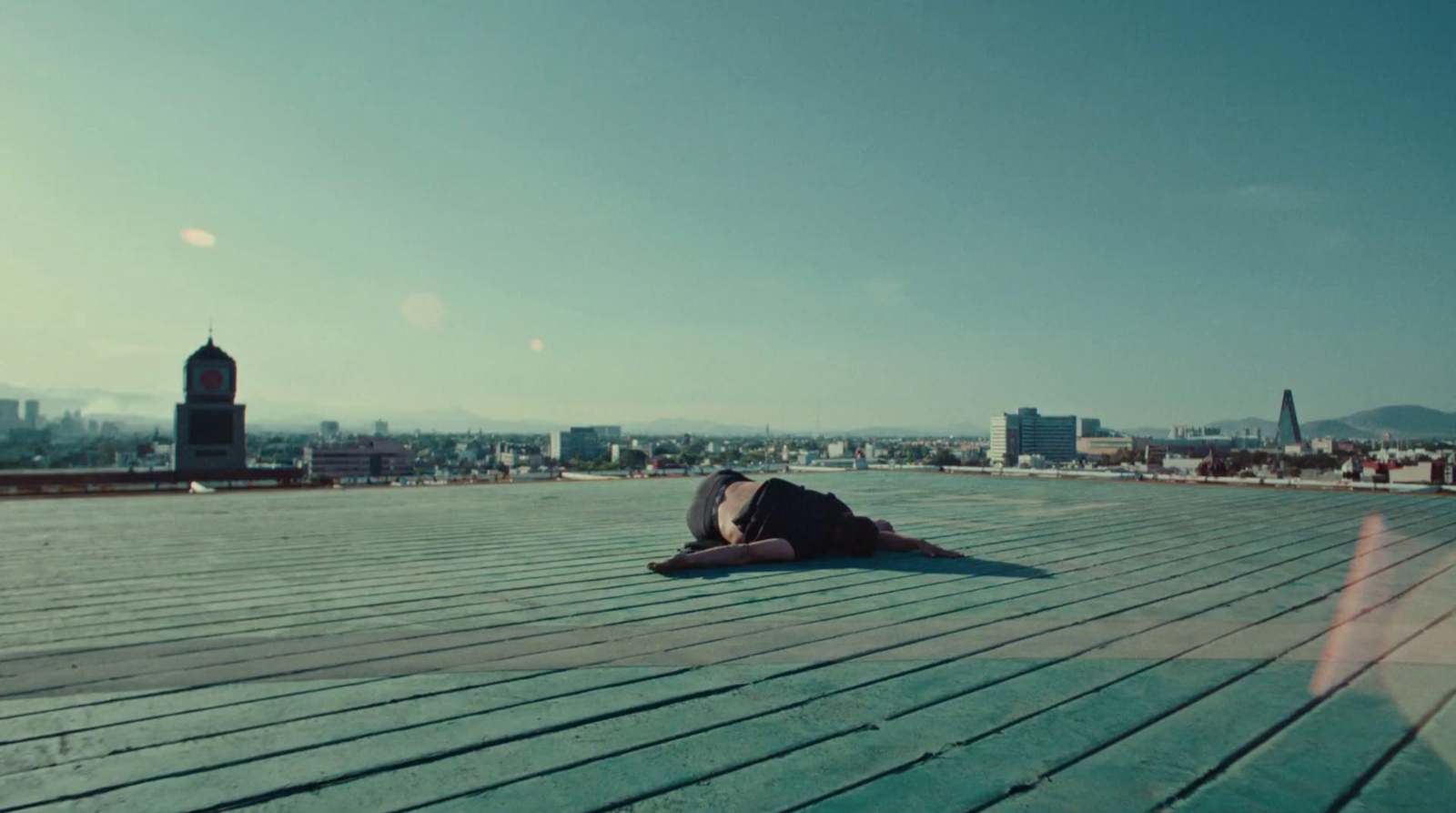 a person laying on top of a wooden floor