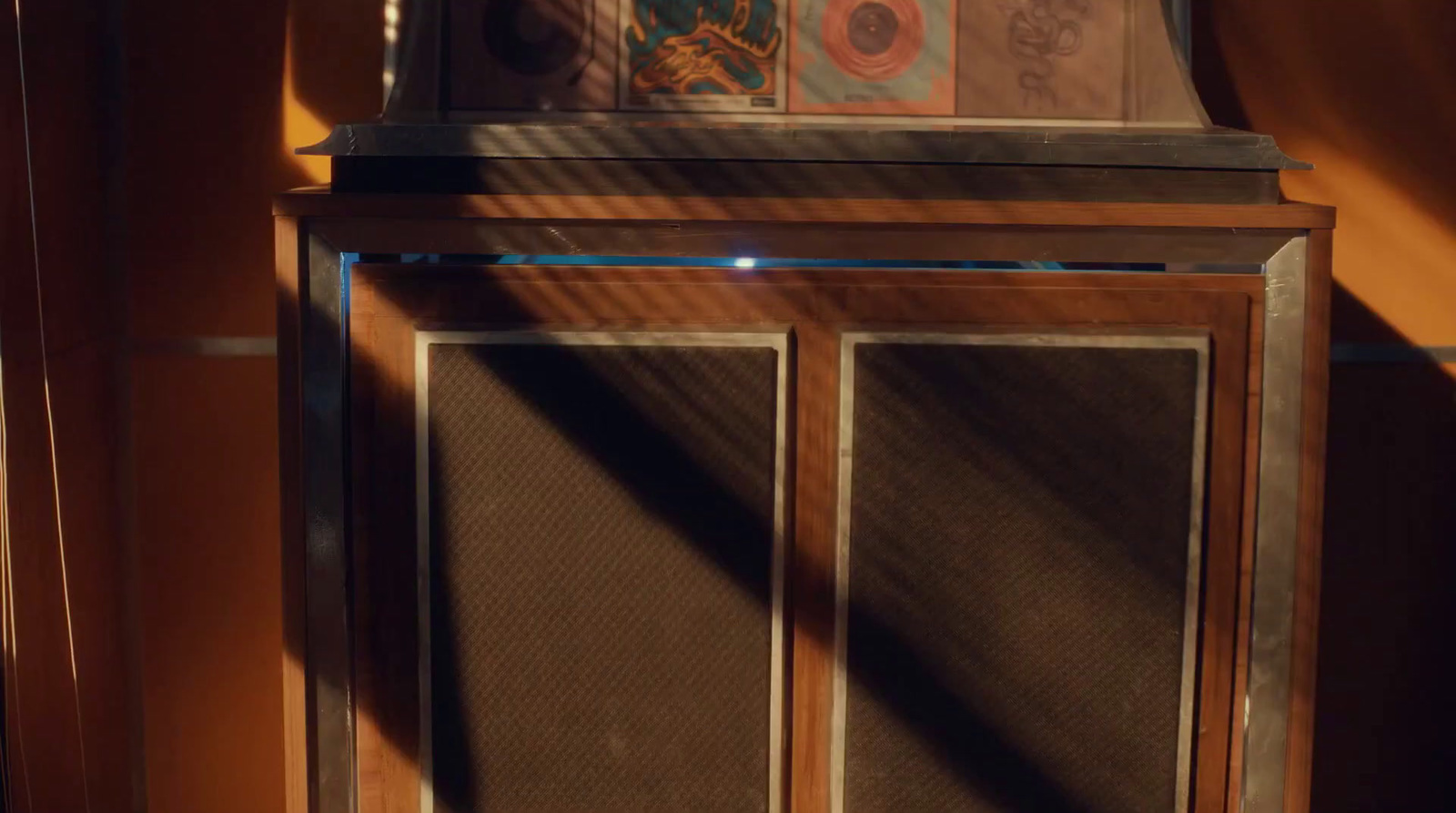 a grandfather clock sitting on top of a wooden shelf