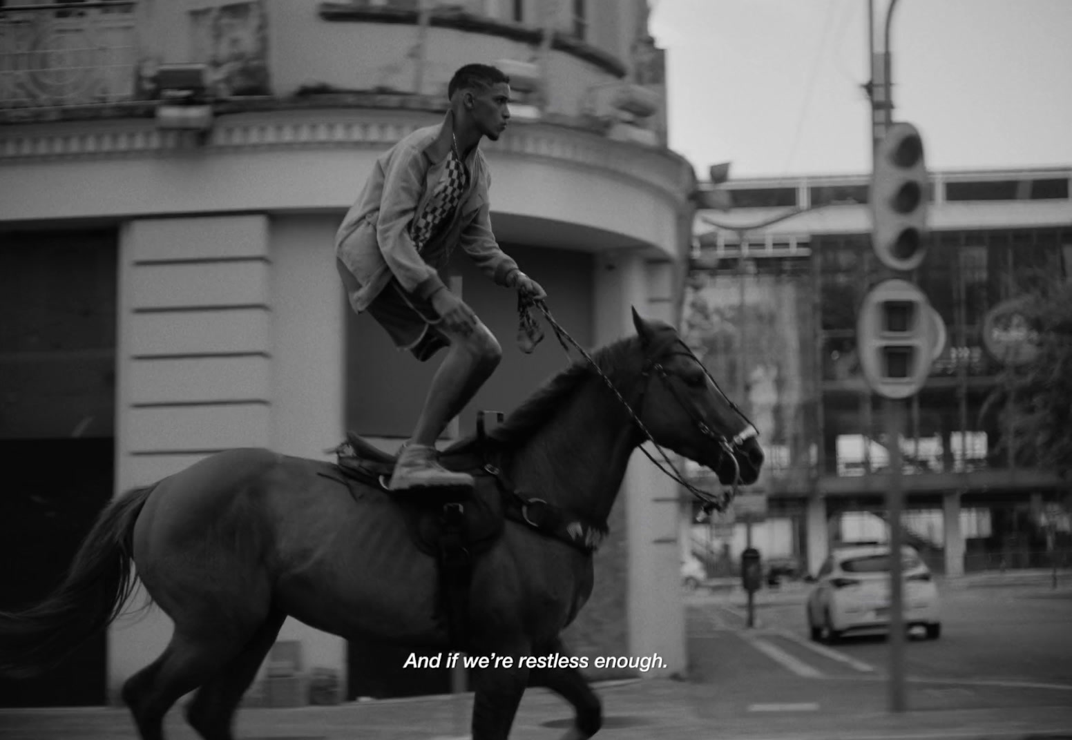 a man riding on the back of a brown horse