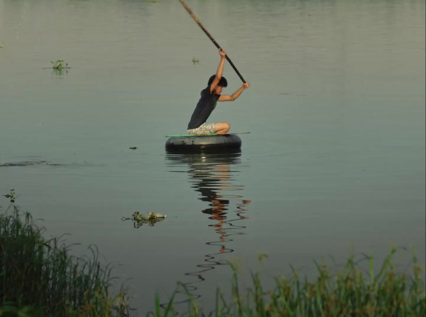 a person on a paddle board in a body of water