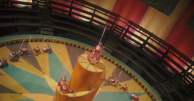 an aerial view of a carnival ride at night