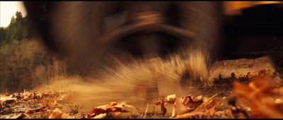 a blurry photo of a person walking through a forest