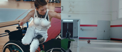 a woman in a wheelchair in a gym