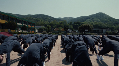 a large group of people standing in front of a mountain