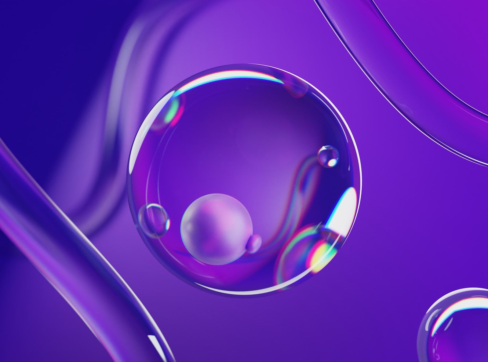 a close up of a drop of water on a purple background