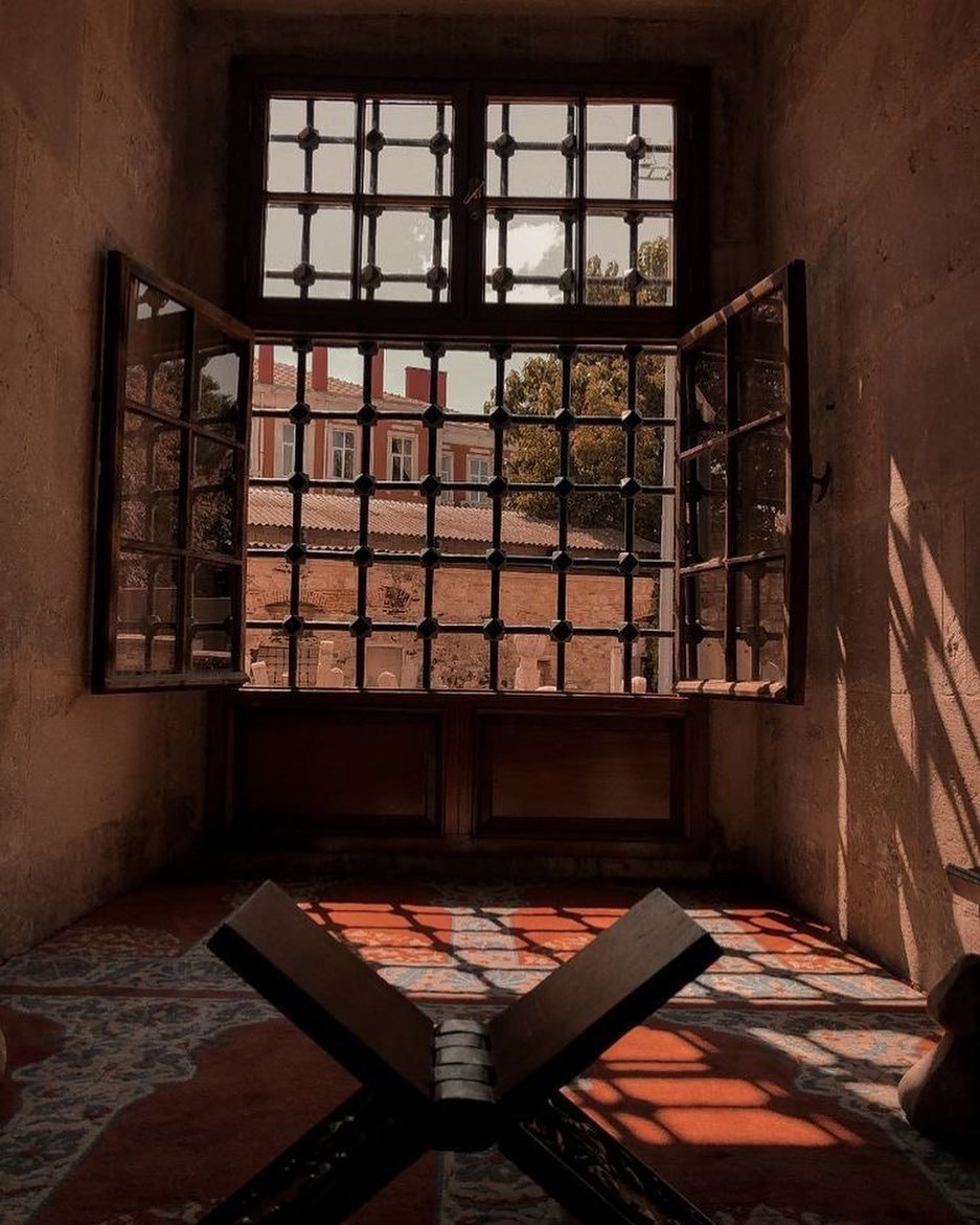 a room with a window and a table in it