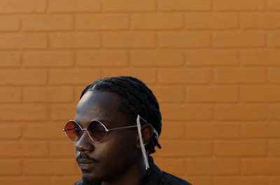 a man with a pair of sunglasses on his head