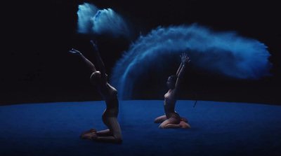 a couple of women are performing on a stage