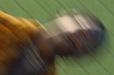 a blurry image of a person holding a tennis racquet