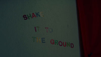 a white wall with writing on it that says shake it to the ground