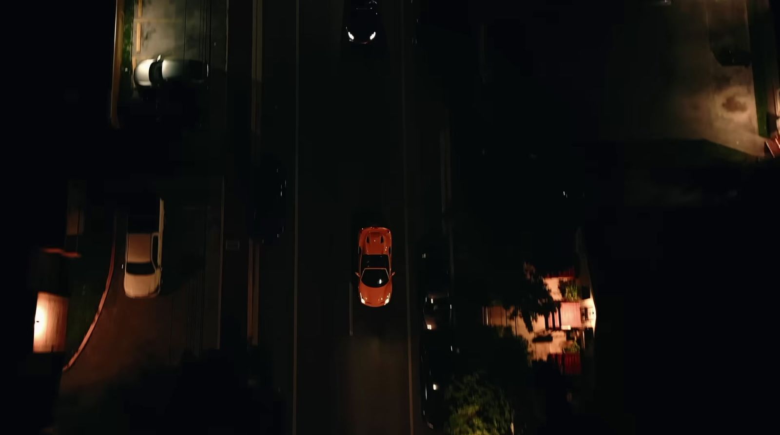 an overhead view of a street at night