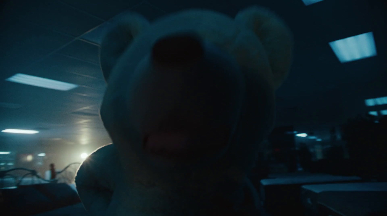 a stuffed animal is shown in a dark room