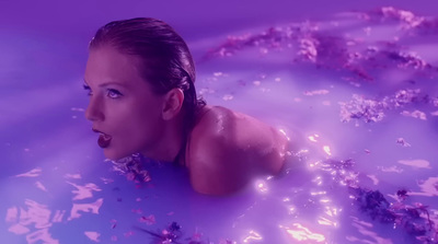 a woman is floating in a pool of water